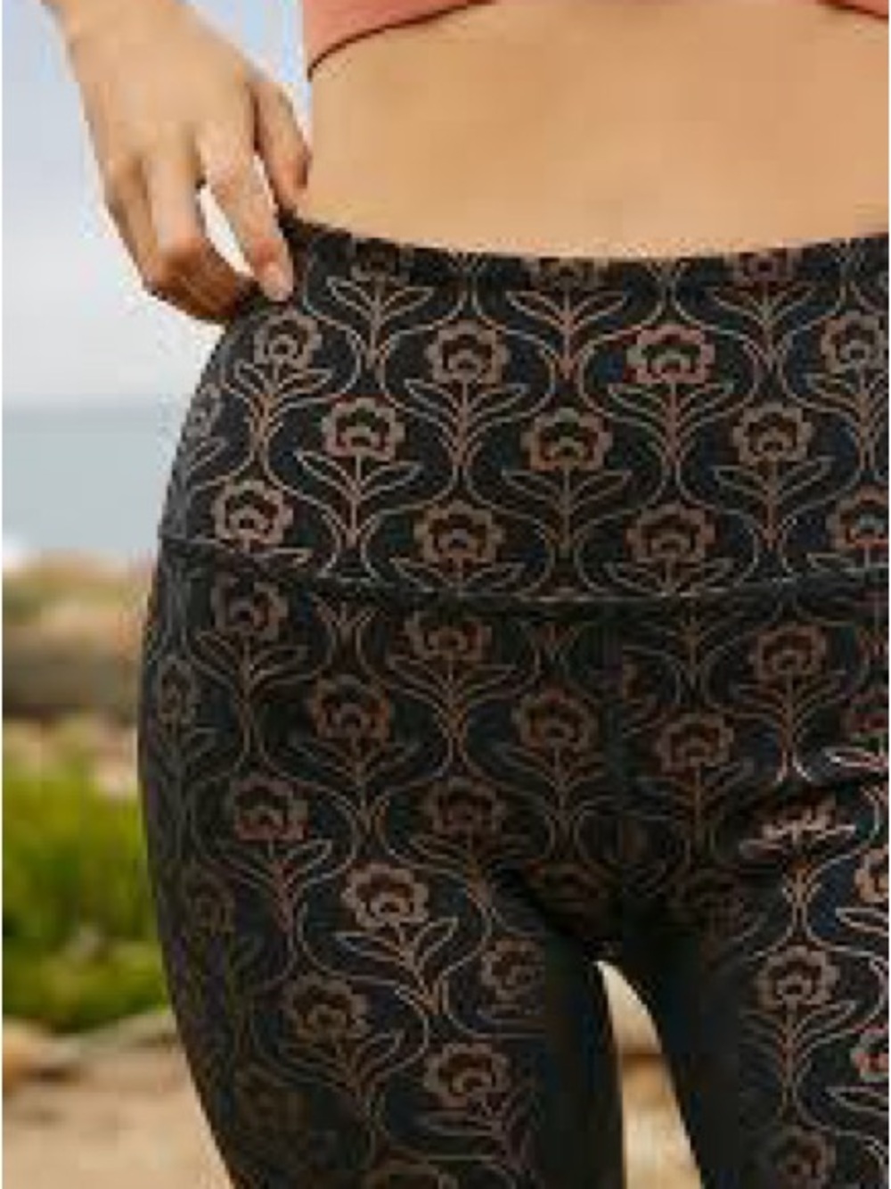 Beyond Yoga Black leggings with Metallic Rose Gold Design.